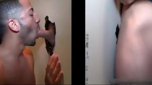 Sexy stud gets his massive white penis sucked through gloryhole